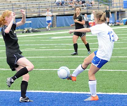 Bailey Gartrell, right, takes a shot. (Photo by Kevin Nagle)