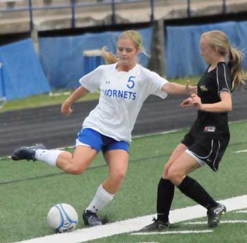 Katie Moore (5) fends off a Central player. (Photo by Kevin Nagle)