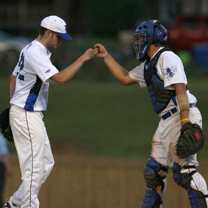 Bryant catcher Hayden Lessenberry congratulates pitcher Caleb Milam after a strong inning. (Photo by Rick Nation)
