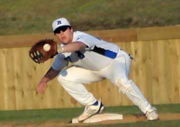 Tyler Pickett takes a throw to first. (Photo by Kevin Nagle)