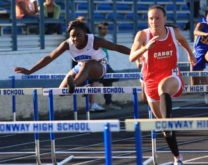 Alexis Royal, left, clears a hurdle. (Photo courtesy of Carla Thomas)