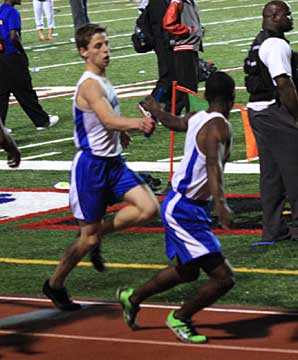 Michael Smith, left, hands off to teammate James Glasper. (Photo courtesy of Carla Thomas)