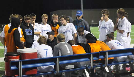 Bryant head coach Jason Hay talks to his team during a break in Tuesday's action. (Photo by Kevin Nagle)