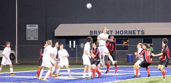 Players from both teams scramble for possession. (Photo by Kevin Nagle)