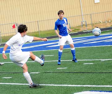 Bryant's Bryce Denker sends a shot towards the goal. (Photo by Kevin Nagle)