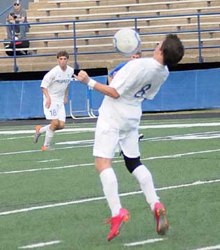 Ben Stukenborg, 8, takes a shot off his chest to stop a goal while teammate Peter Alverio follows up the play. (Photo by Kevin Nagle)