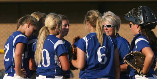 Bryant head coach Debbie Clark meets with her infield. (Photo by Rick Nation)