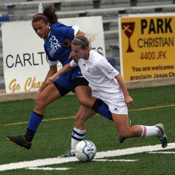 Bryant's McKenzie Adams, left, gets tangled up with a Southside player. (Photo by Rick Nation)