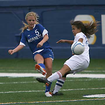 Bryant's Katie Moore (5) kicks the ball past a Southside player. (Photo by Rick Nation)