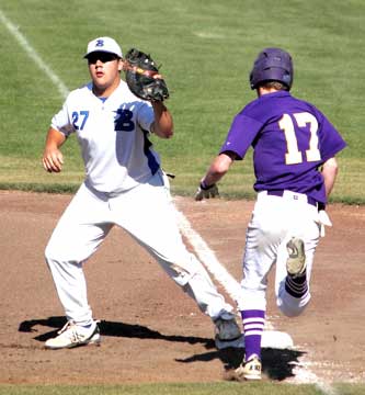 First baseman Landon Pickett takes a throw to retire Catholic's Drew Price (17). (Photo courtesy of Phil Pickett)