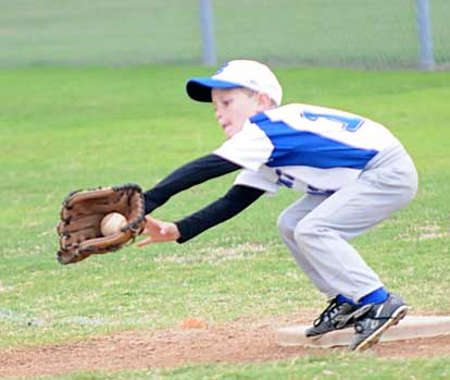 C.J. Nagle takes a throw at first. (Photo by Kevin Nagle)