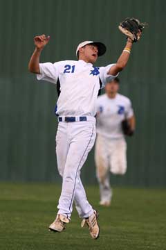 Tyler Nelson reaches back to grab a pop up. (Photo by Rick Nation)