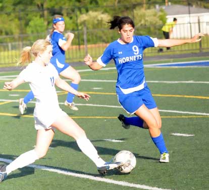 Bryant's London Abernathy (9) defends against a drive by a Conway player. (Photo by Kevin Nagle)