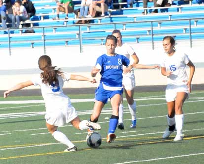 Bryant's Shelby Gartrell (8) vies for control of the ball. (Photo by Kevin Nagle) 