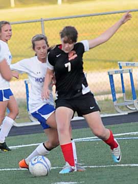 Bryant's Shelby Gartrell fights for possession. (Photo by Kevin Nagle)