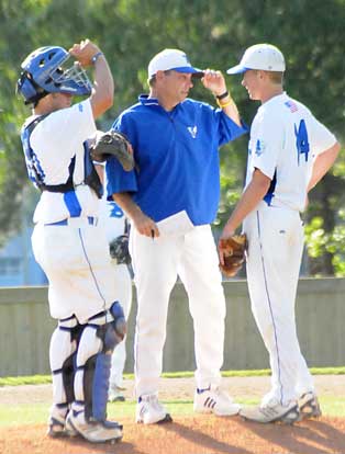 Bryant head coach Kirk Bock meets with catcher Hayden Lessenberry and pitcher Jordan Taylor. (Photo by Kevin Nagle)