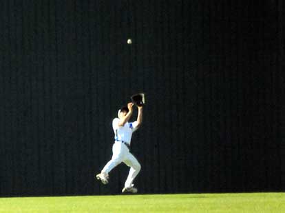 Bryant centerfielder Josh Pultro goes back for a deep flyball. (Photo by Kevin Nagle)