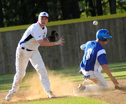 Lucas Castleberry, right, fires to first after retiring Monticello's Cole Connelley (8) in what almost turned out to be a triple play. (Photo by Kevin Nagle)