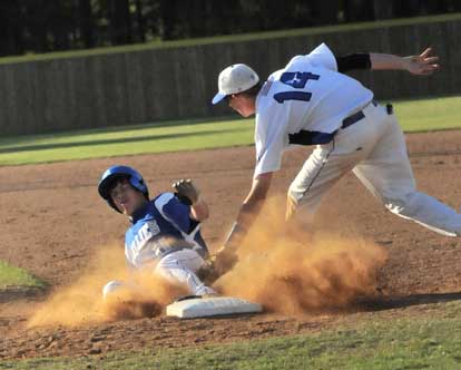 Bryant's Jordan Taylor (14) applies the tag on Monticello's Troy Brunson to complete a successful pickoff play. (Photo by Kevin Nagle)