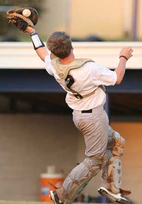 Catcher Zach Graddy tries to haul in a foul pop during Monday's game. (Photo by Rick Nation)