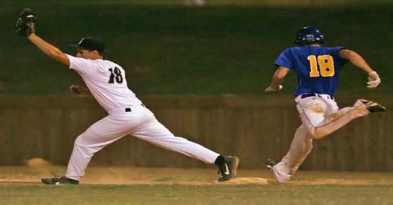 Bryant first baseman Hunter Mayall takes a throw just in time to retire Sheridan's Landon Moore. (Photo by Rick Nation)