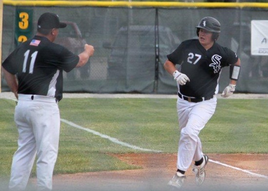 Tyler Brown is congratulated by coach Darren Hurt after his home run Friday.  (Photo courtesy of Phil Pickett)