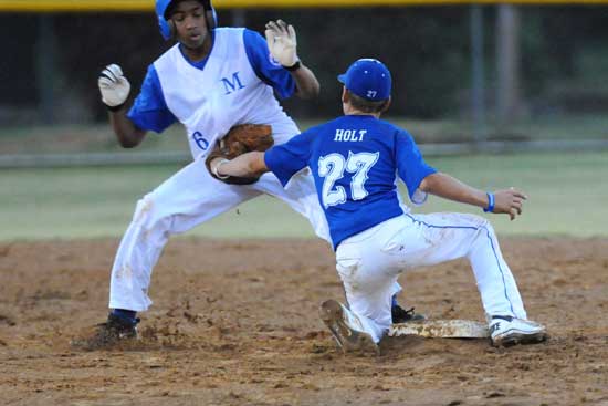 Dalton Holt applies a tag on a Monticello baserunner. (Photo by Ron Boyd)