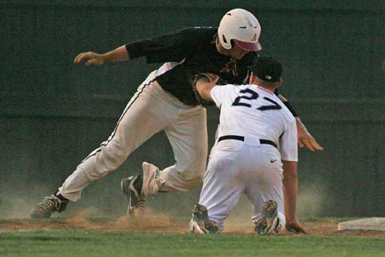 Bryant's Tyler Brown tags out Levi Saxby on a pickoff play at third. (PHoto by Rick Nation)