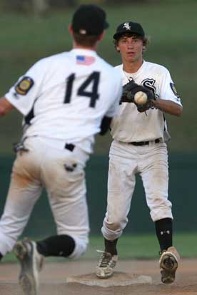 Ozzie Hurt takes a throw from Jordan Taylor. (Photo by Rick Nation)