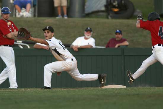 Hunter Mayall stretches for a throw at first. (Photo by Rick Nation)