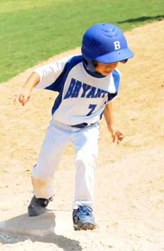 Chase Small rounds third and heads for home. (Photo by Kevin Nagle)