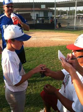 Myers Buck gets measured for a ring, part of the award ceremony at the Sylvan Hills tourney. 