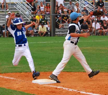 Ryan Lessenberry stretches to try to beat a throw to first.