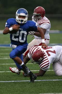 Bryant's Jalen Bell breaks a tackle. (Photo by Rick Nation)