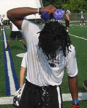 Senior Dillon Winfrey applies an ice sponge during Wednesday morning's practice.