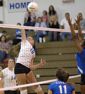 Alyssa Anderson leaps high for a spike. (Photo by Kevin Nagle)