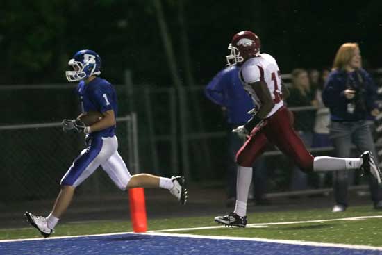 Sawyer Nichols (1) reaches the end zone ahead of a Texarkana defender. (Photo by Rick Nation)