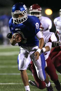 Caleb Thomas (8) breaks through the Texarkana defense. (Photo by Rick Nation)