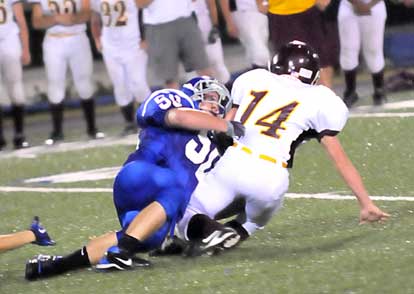 Bryant's Austin Vass (50) gets a sack. (Photo by Kevin Nagle)