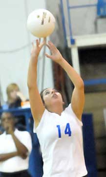 Carley Choate sets for a teammate. (Photo by Kevin Nagle)