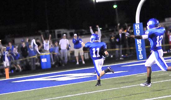 Hayden Daniel points to the kids in the back of the end zone as he scores the go-ahead touchdown Friday night against Little Rock Catholic. (Photo by Kevin Nagle)