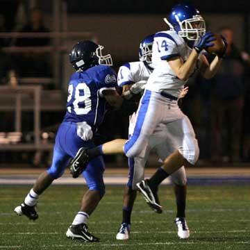 Bryce Harden (14) intercepts in front of teammate Mar'Kevius Nelson (11) and Conway's Karlil Johnson (28). (Photo by Rick Nation)