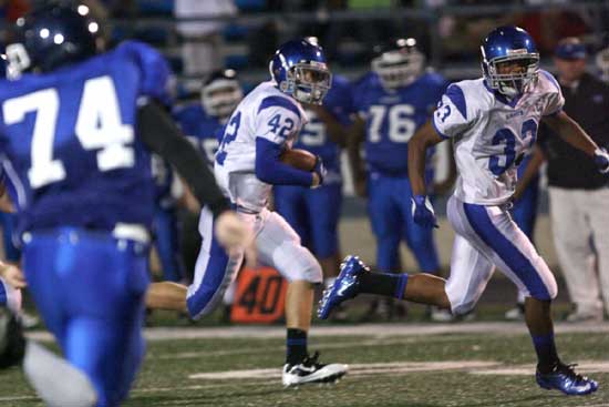 Brendan Young (33) escorts Matt Shiew (42) toward the end zone after Shiew's interception. (Photo by Rick Nation)