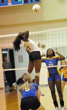 Brianna White (17) skies on an attack. (Photo by Kevin Nagle)