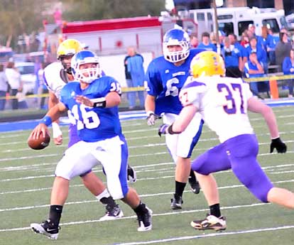 Hayden Lessenberry (16) delivers under pressure. (Photo by Kevin Nagle)