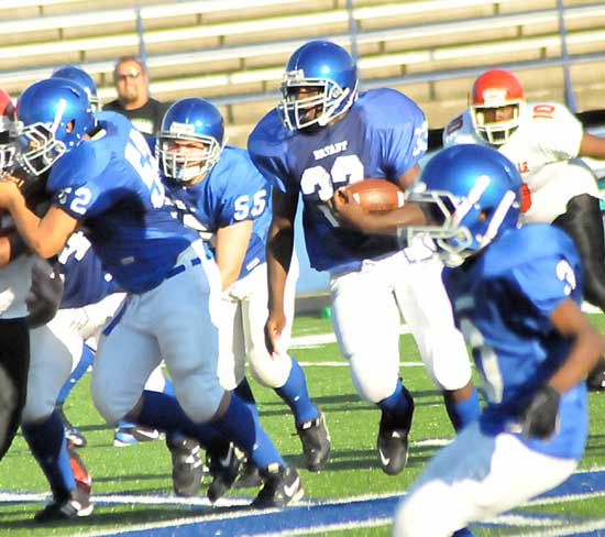 Bryant White running back Demaja Price (32) follows the blocking of Justin Cagle (52) and Dylan Penix (55). (Photo by Kevin Nagle)