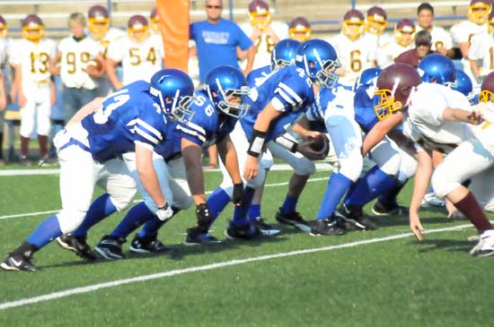 The Bryant Blue offensive line, including Peyton Robertson (43), Jean Paul Marrero (66) and Austin Fason (42), led the way to 191 yards of offense Thursday night. (Photo by Kevin Nagle)