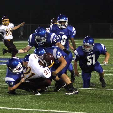 Bryce Hardin (14), Devin Kelly (67), Ryan Hall (53), Jordan McDonald (38) and Connor Chapdelaine (51) converge on Lake Hamilton's Jonathan Benitez. (Photo by Rick Nation)