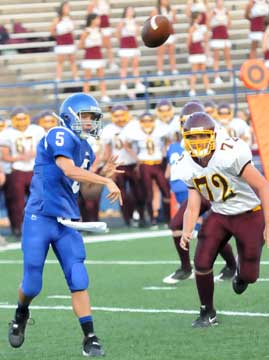 Bryant's Brandon Warner gets a throw away before Lake Hamilton's D.J. Everhart arrives. (Photo by Kevin Nagle)