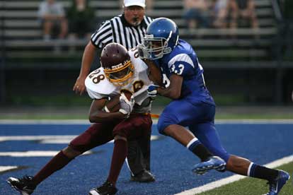 Bryant linebacker Brendan Young makes a bid to drop Lake Hamilton's Donell West for a safety. (Photo by Rick Nation)